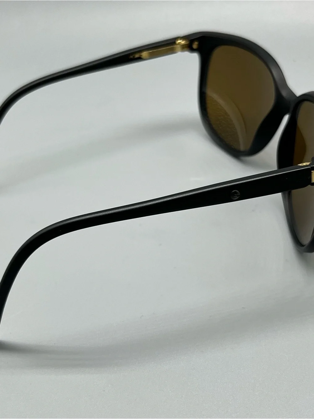 Revo Matte Black Sunglasses with Purple Mirrored Lenses